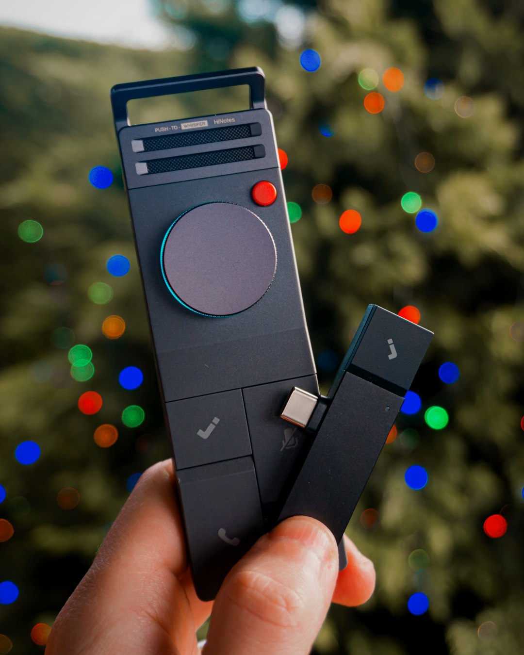 Christmas-themed product and lifestyle photography featuring the HiDock P1 and HiDock P1 Mini. Shot in a cozy home-office desk setup and living/dining room with natural Christmas decor, including a Christmas tree and gift unboxing moments, as well as outdoor winter-inspired shots. The images capture modern work-from-home tools in a warm, seasonal atmosphere blending productivity, technology, and everyday life during the holidays. Photographed by Matúš Gocman in collaboration with HiDock.